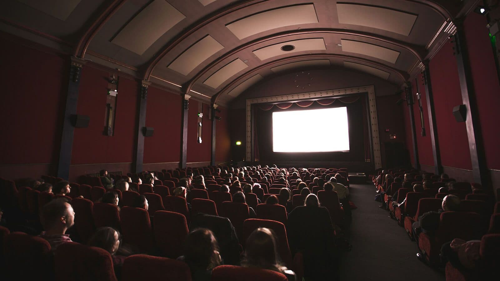 A darkened cinema screen setting the stage for epic fantasy films recommended for Game of Thrones fans