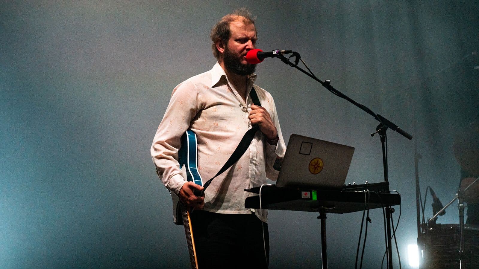Justin Vernon performing at Eaux Claires 2026, delivering a surprise Bob Dylan covers set and Bon Iver reunion